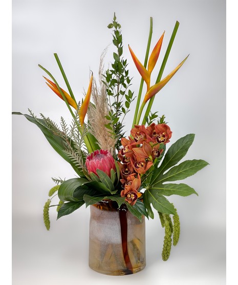 silver toned vase with dramatic flowers inside
